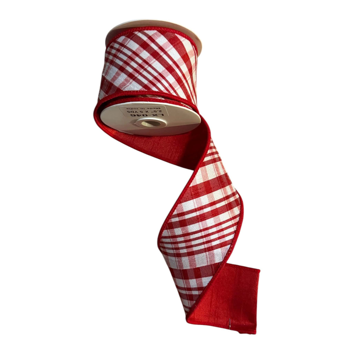 2.5-inch x 5-yard red and white plaid reversible designer ribbon on a white spool, featuring a woven check face with deep-red stitched edges and a solid deep-red velvet reverse visible on the folded tail.