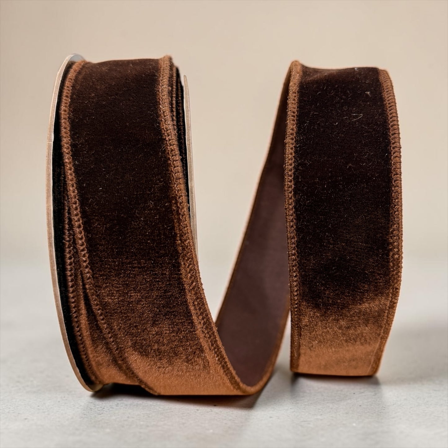 D. Stevens 1.5 inch chocolate brown velvet wired designer ribbon with matching brown Dupion backing on a 10-yard roll.