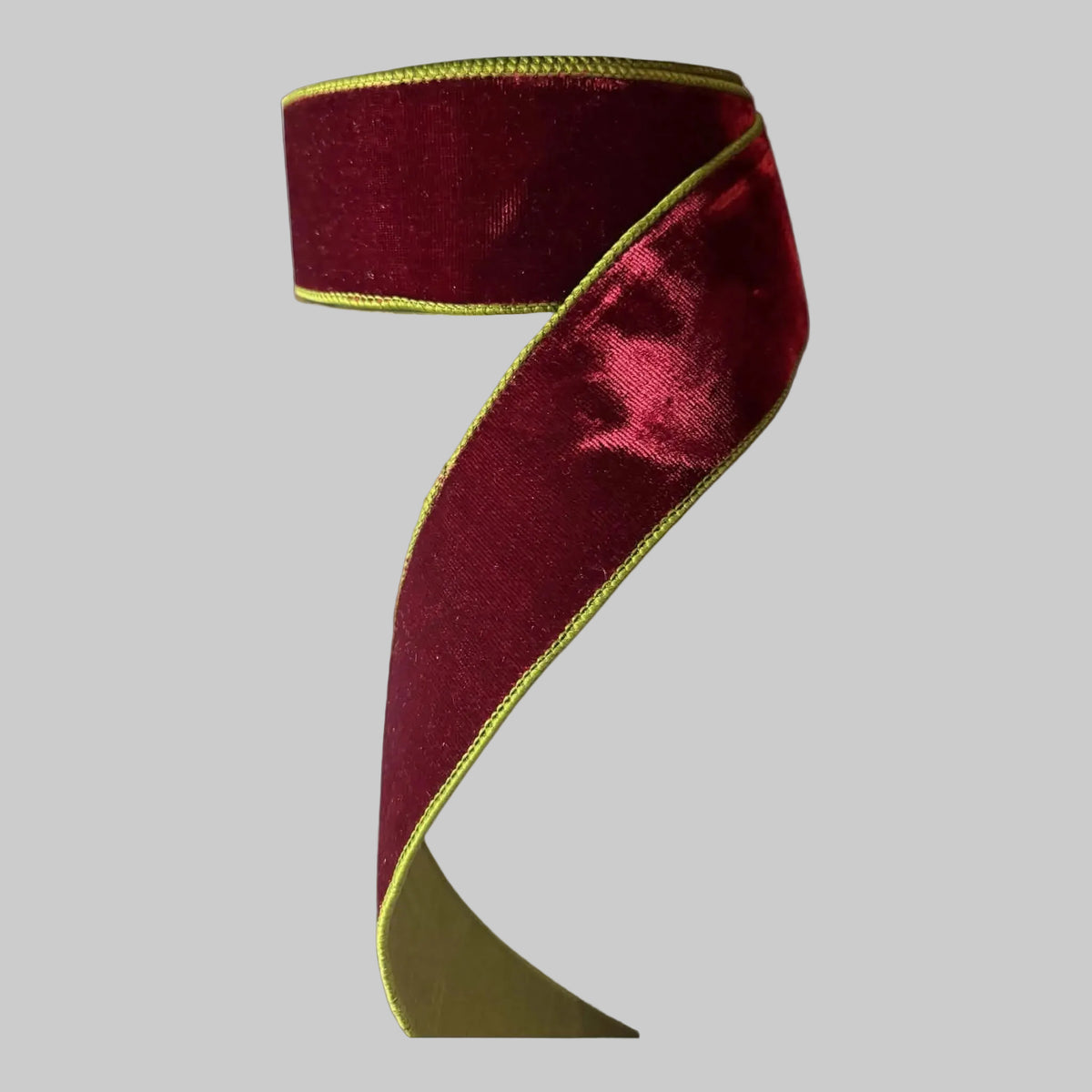 arrisilk 2.5-inch x 10-yard two-tone velvet designer ribbon featuring a plush crimson-burgundy face with a contrasting gold velvet reverse and coordinating stitched edges.