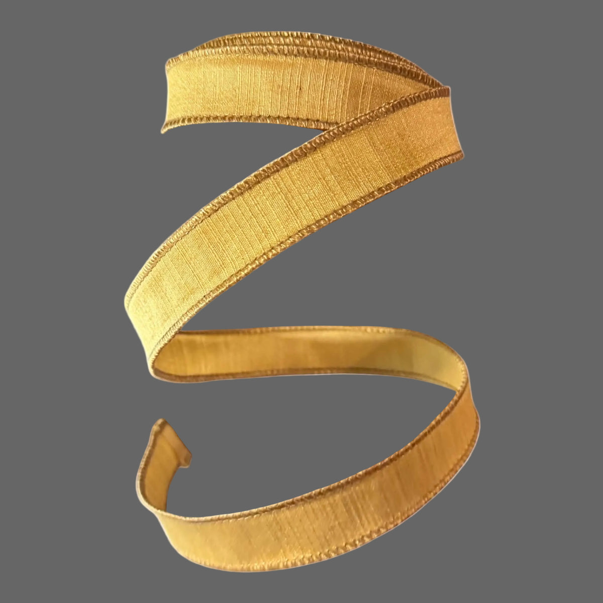 Farrisilk 1-inch x 10-yard antique-gold designer ribbon featuring a fine vertical ribbed texture, brushed matte metallic sheen, and coordinating deeper-gold stitched edges.