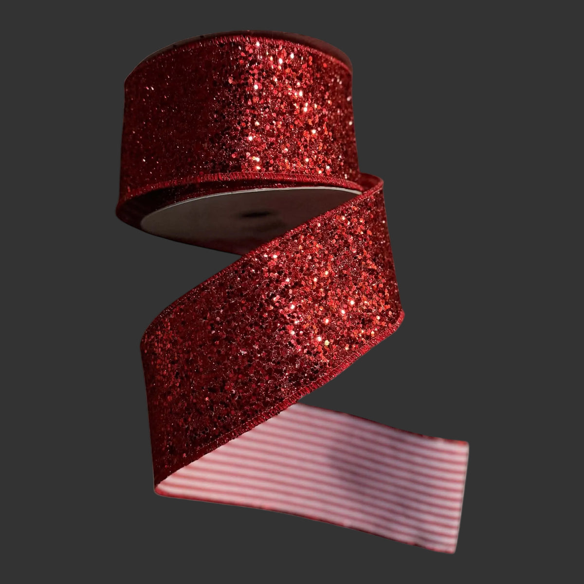2.5-inch x 10-yard reversible designer ribbon featuring a glittered crimson face with matching glitter edges and a red-and-white ticking stripe reverse.