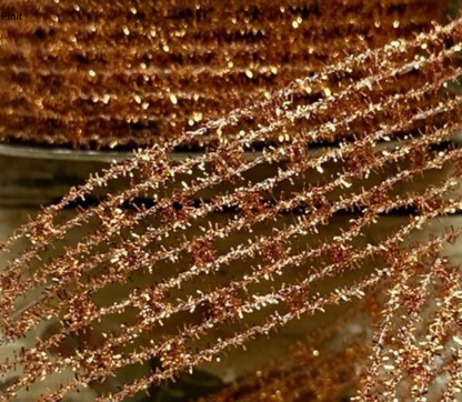 Metallic copper diamond stretch tinsel designer ribbon, 1.5 inches wide by 10 yards long, with sparkling copper mesh texture for fall and Christmas wreath making.