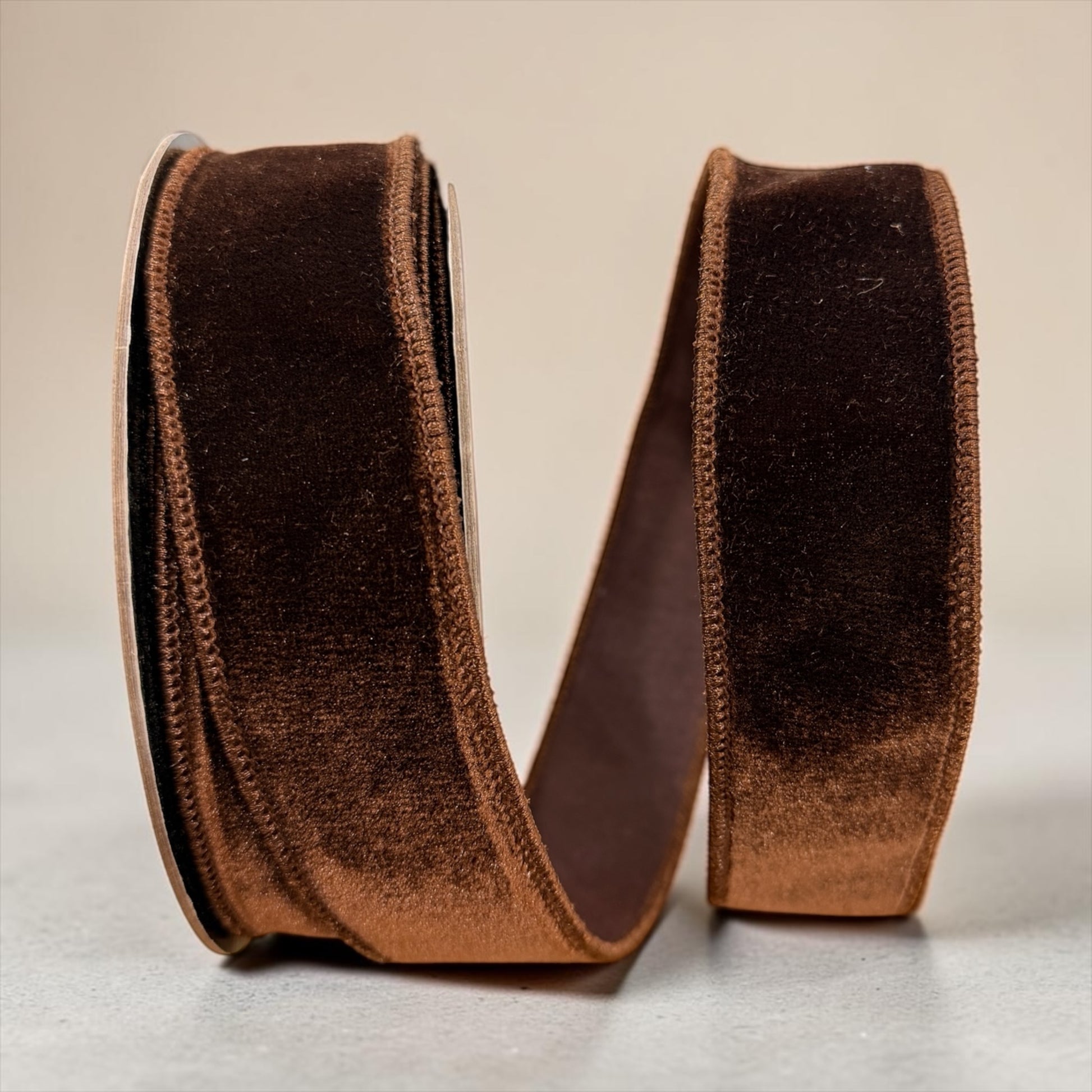 D. Stevens 1.5 inch chocolate brown velvet wired designer ribbon with matching brown Dupion backing on a 10-yard roll.
