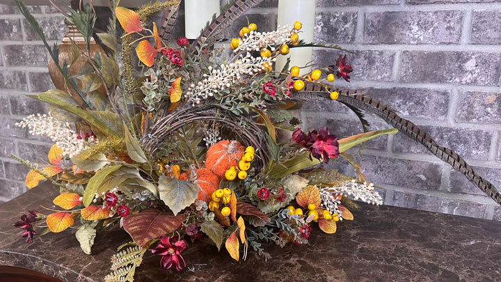 Eclectic “One of a Kind” Fall Grapevine Stand arrangement. Fuzzy Orange Jute wrapped stem pumpkins with golden berries with Pheasant Feather