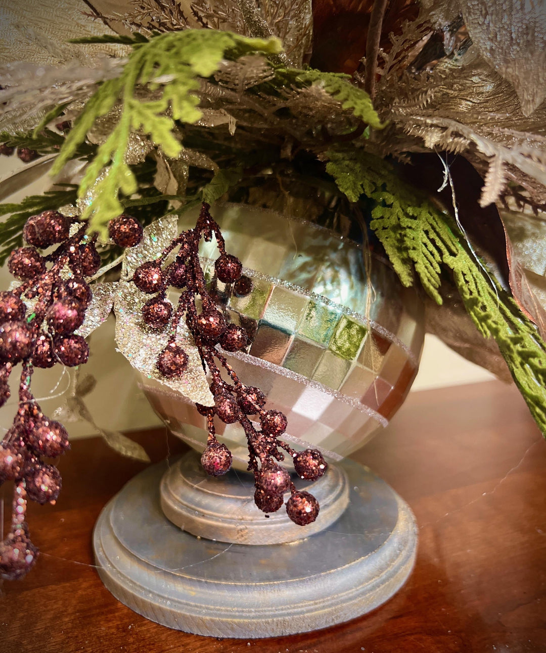 Unique Oranament arrangement with designer magnolias stacked on a wooden disc - Designer netting ribbon