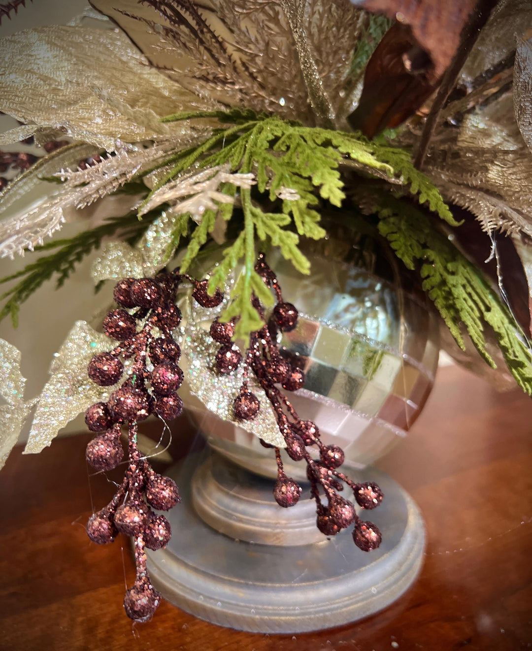Unique Oranament arrangement with designer magnolias stacked on a wooden disc - Designer netting ribbon
