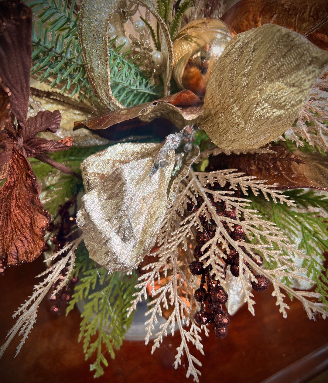 Unique Oranament arrangement with designer magnolias stacked on a wooden disc - Designer netting ribbon