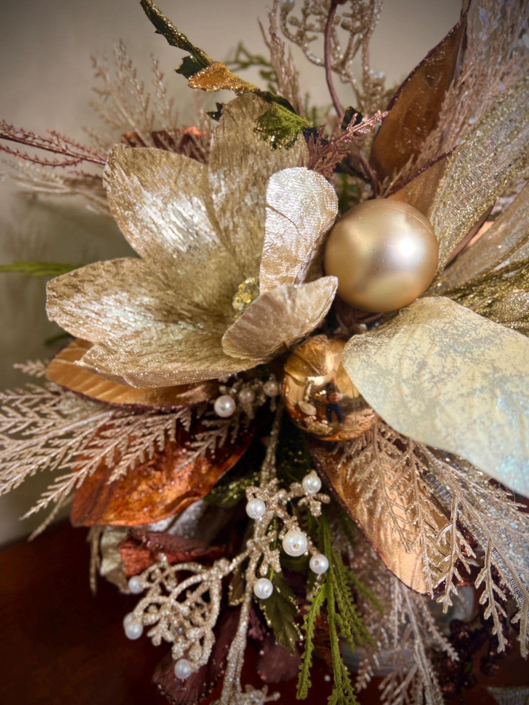 Unique Oranament arrangement with designer magnolias stacked on a wooden disc - Designer netting ribbon