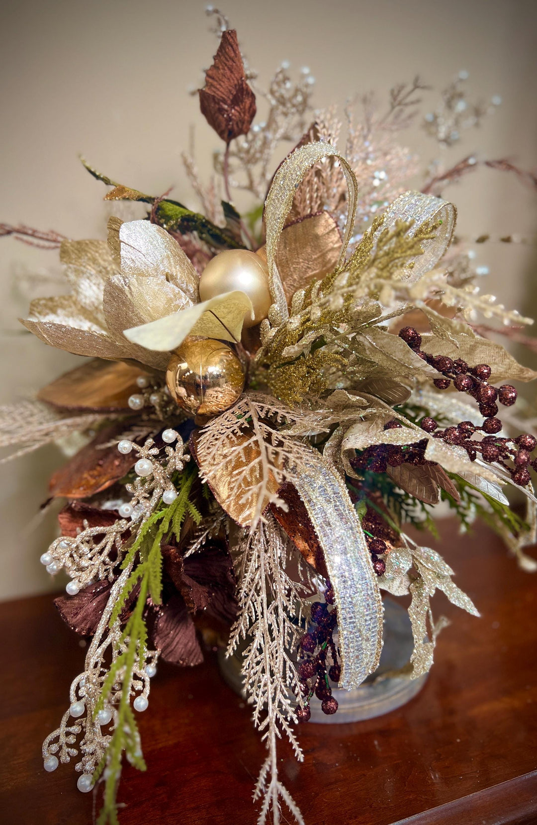 Unique Oranament arrangement with designer magnolias stacked on a wooden disc - Designer netting ribbon