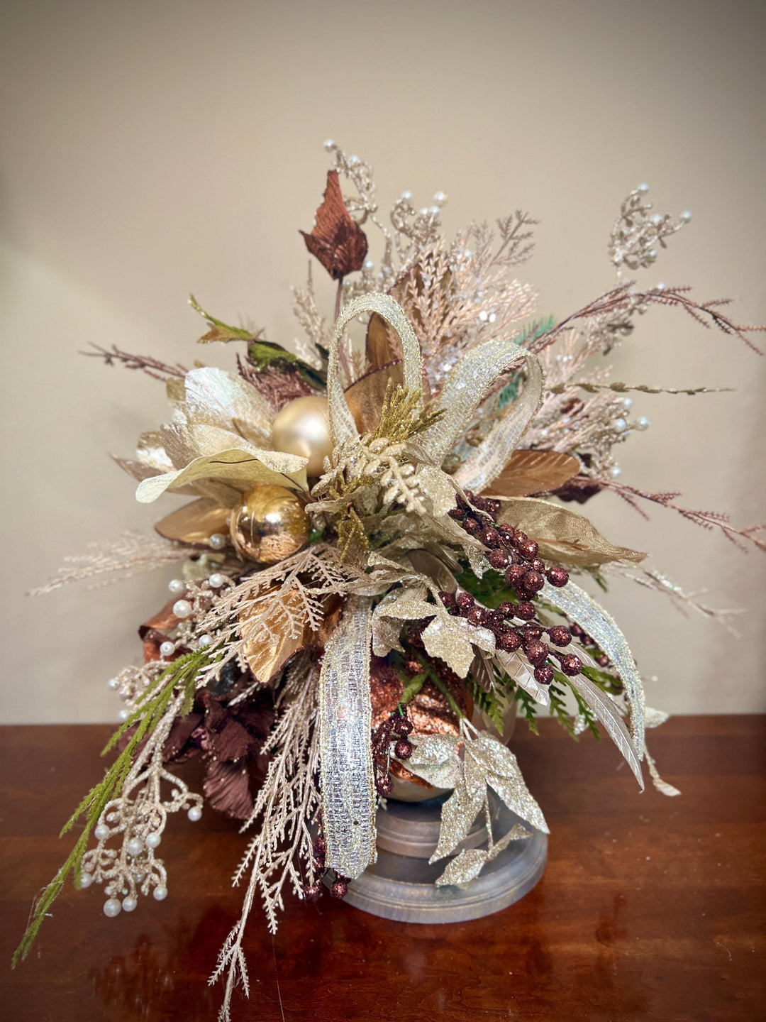 Unique Oranament arrangement with designer magnolias stacked on a wooden disc - Designer netting ribbon