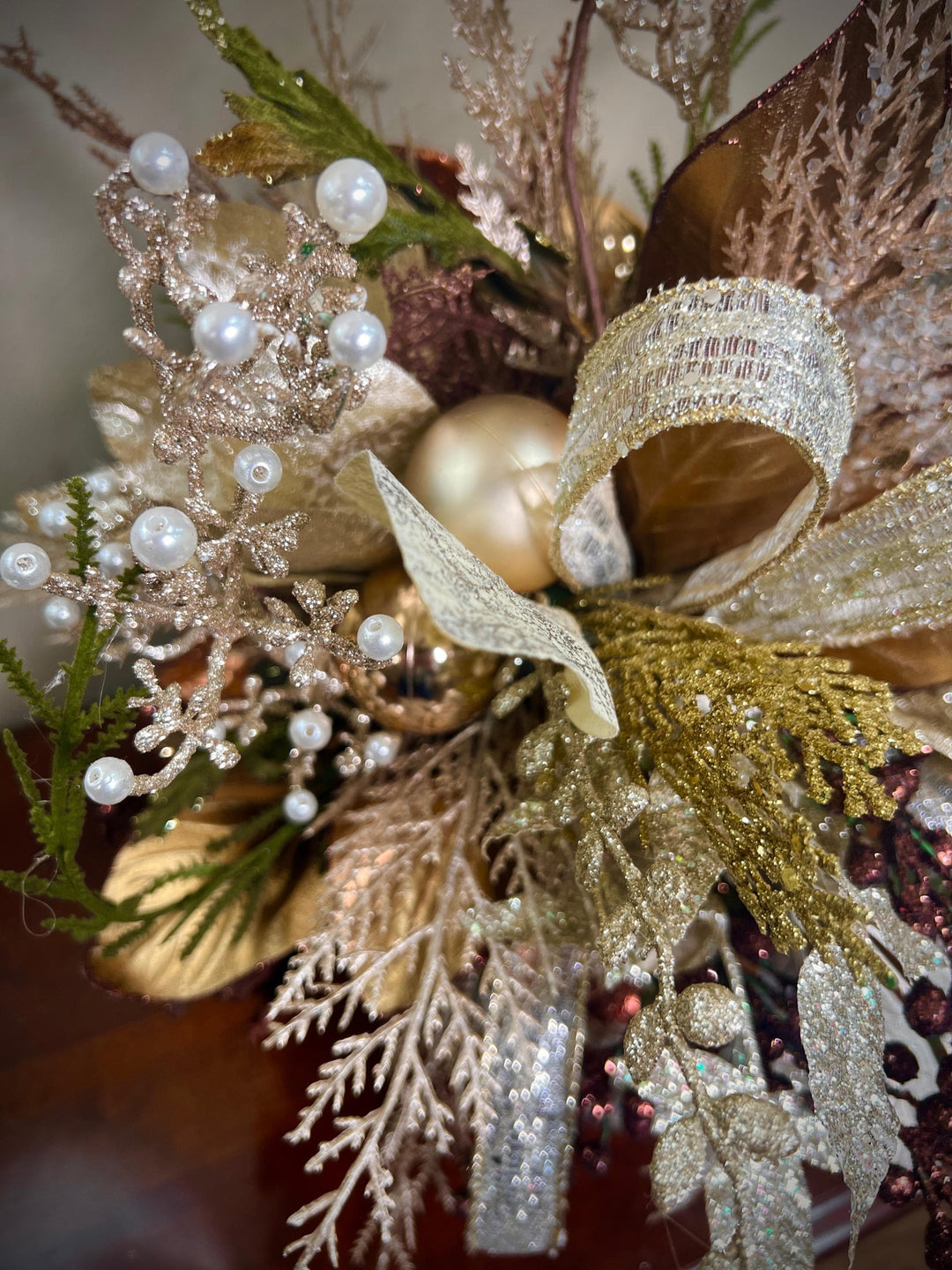 Unique Oranament arrangement with designer magnolias stacked on a wooden disc - Designer netting ribbon