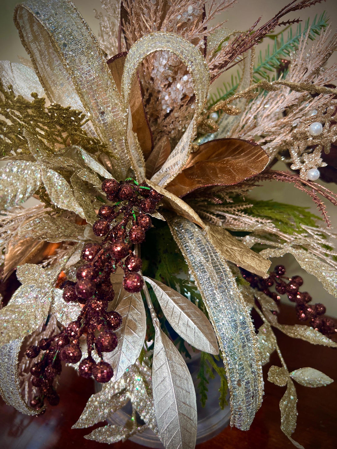Unique Oranament arrangement with designer magnolias stacked on a wooden disc - Designer netting ribbon