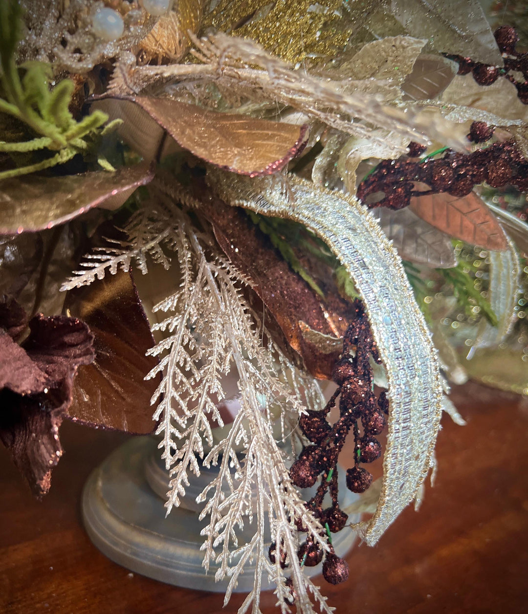 Unique Oranament arrangement with designer magnolias stacked on a wooden disc - Designer netting ribbon