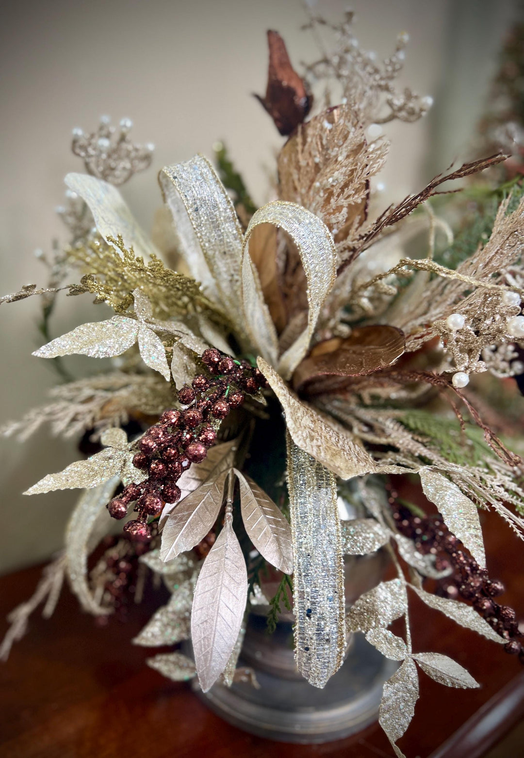 Unique Oranament arrangement with designer magnolias stacked on a wooden disc - Designer netting ribbon