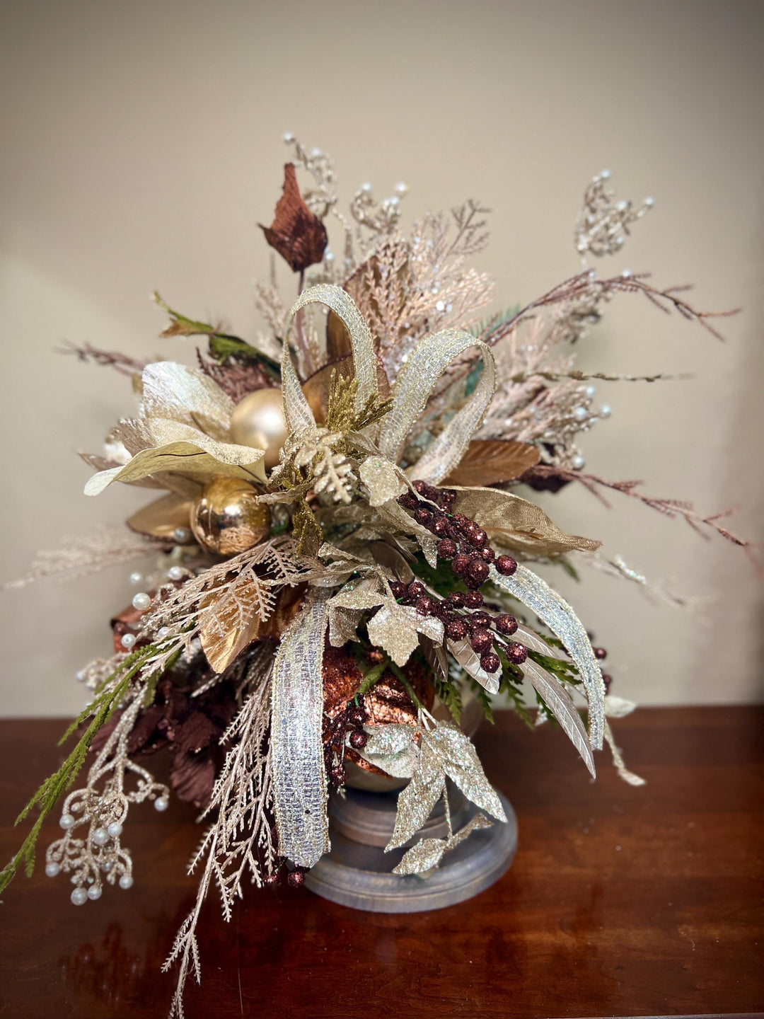 Unique Oranament arrangement with designer magnolias stacked on a wooden disc - Designer netting ribbon